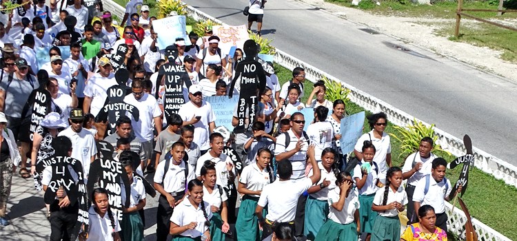 Hundreds of students and other local residents turned out for a march to mark the 62nd anniversary of the Bravo hydrogen bomb test at Bikini Atoll. The march segued into an official commemoration ceremony with speeches by President Heine, US Ambassador Tom Armbruster, and nuclear survivors. Photo: Hilary Hosia