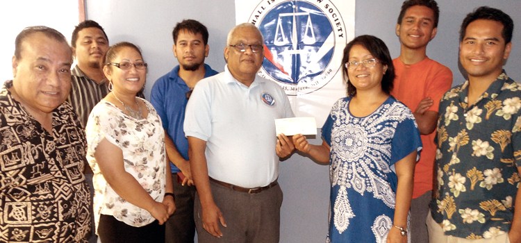 A $500 check was donated by the Marshall Islands Law Society (MILS) to the Radiation Exposure Awareness Crusaders of Humanity – Marshall Islands (REACH-MI)