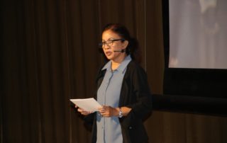 Madeleine Johnson speaks to delegates at the Pacific Resilience Meeting.